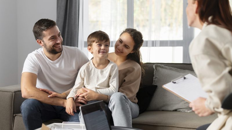 close-up-family-discussing-with-therapist